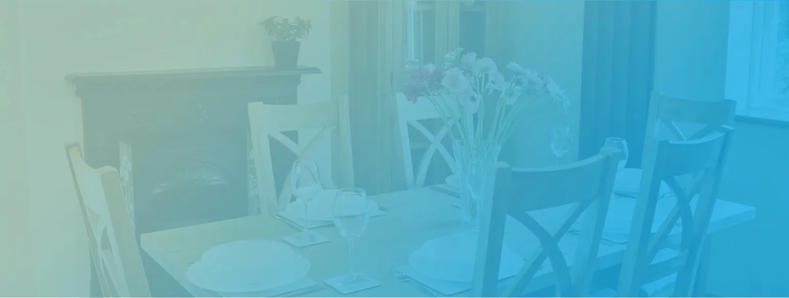 Background image of dining table in the cottage | Garth House Cottages & Studio